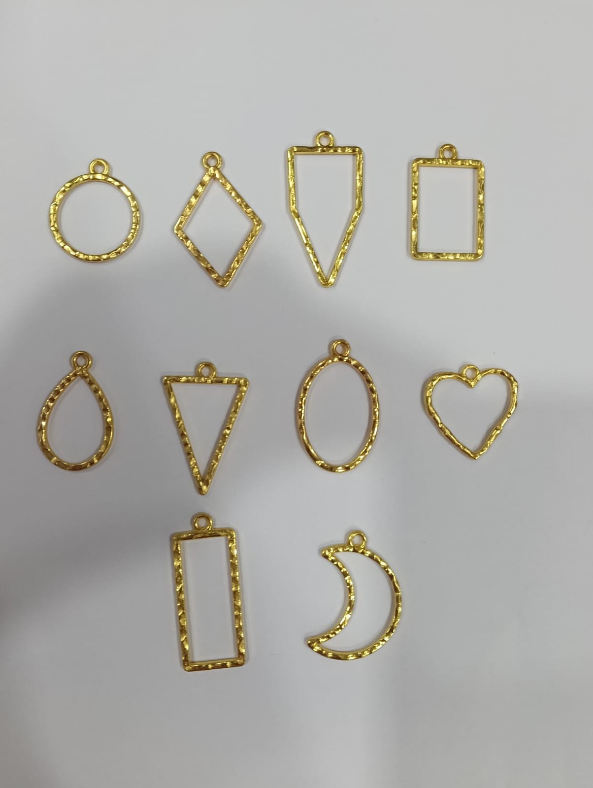 WhatsApp Image 2025-04-11 at 10.51.37 AM Bazel Pendent all shapes gold / Min.Qty-12 Pcs - Image 1
